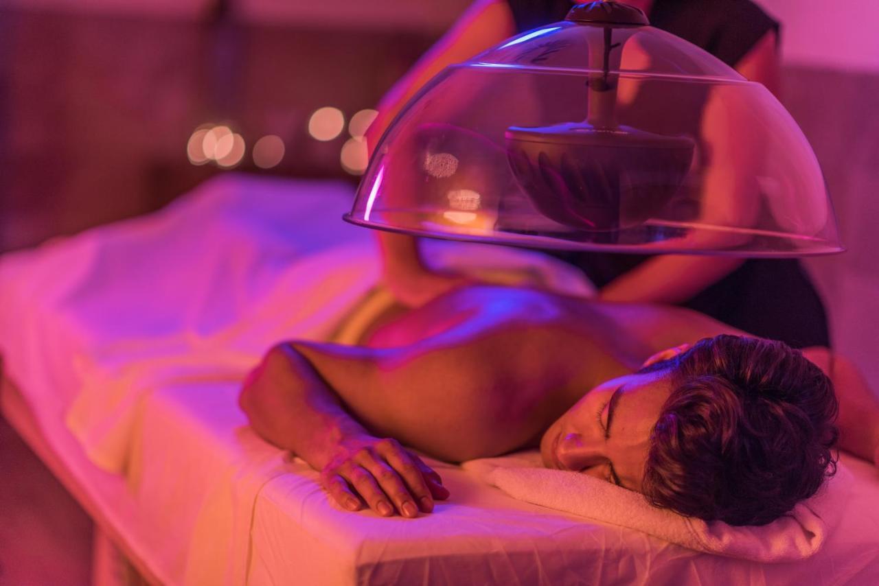 Hard Rock Hotel Goa Calangute Exteriör bild A patient receiving a cupping treatment