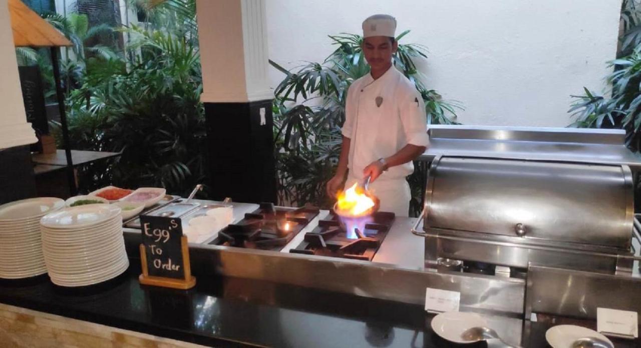 Hard Rock Hotel Goa Calangute Exteriör bild A chef cooking with a blowtorch